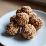 A pile of homemade energy balls coated in oats, perfect for an Easy Snack Smarter High Protein option.