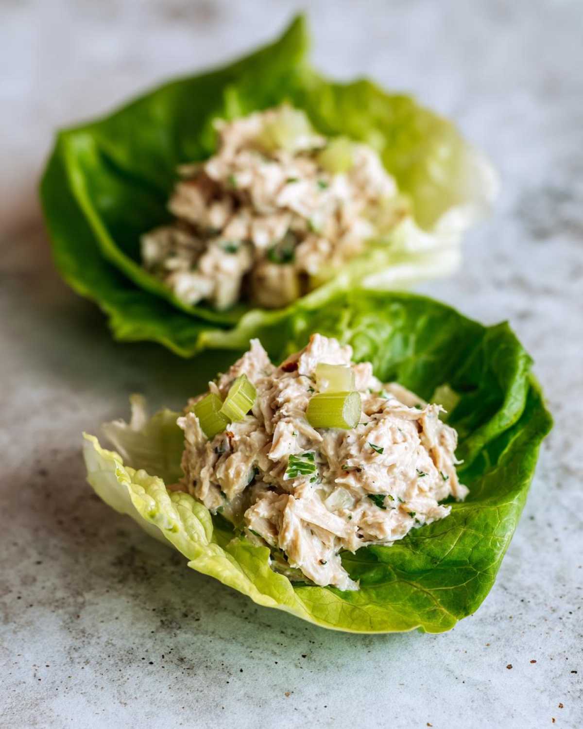 Two servings of healthy chicken salad served in crisp lettuce cups, demonstrating an Easy Easiest Way Eat Healthy.