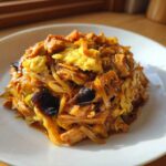 A close-up of Moo Shu Chicken Authentic Chinese Stir Fry Dinner served on a white plate, showing shredded ingredients and scrambled egg.