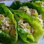 Close-up of creamy tuna salad filling crisp lettuce cups, showing the easiest way to eat this quick meal.